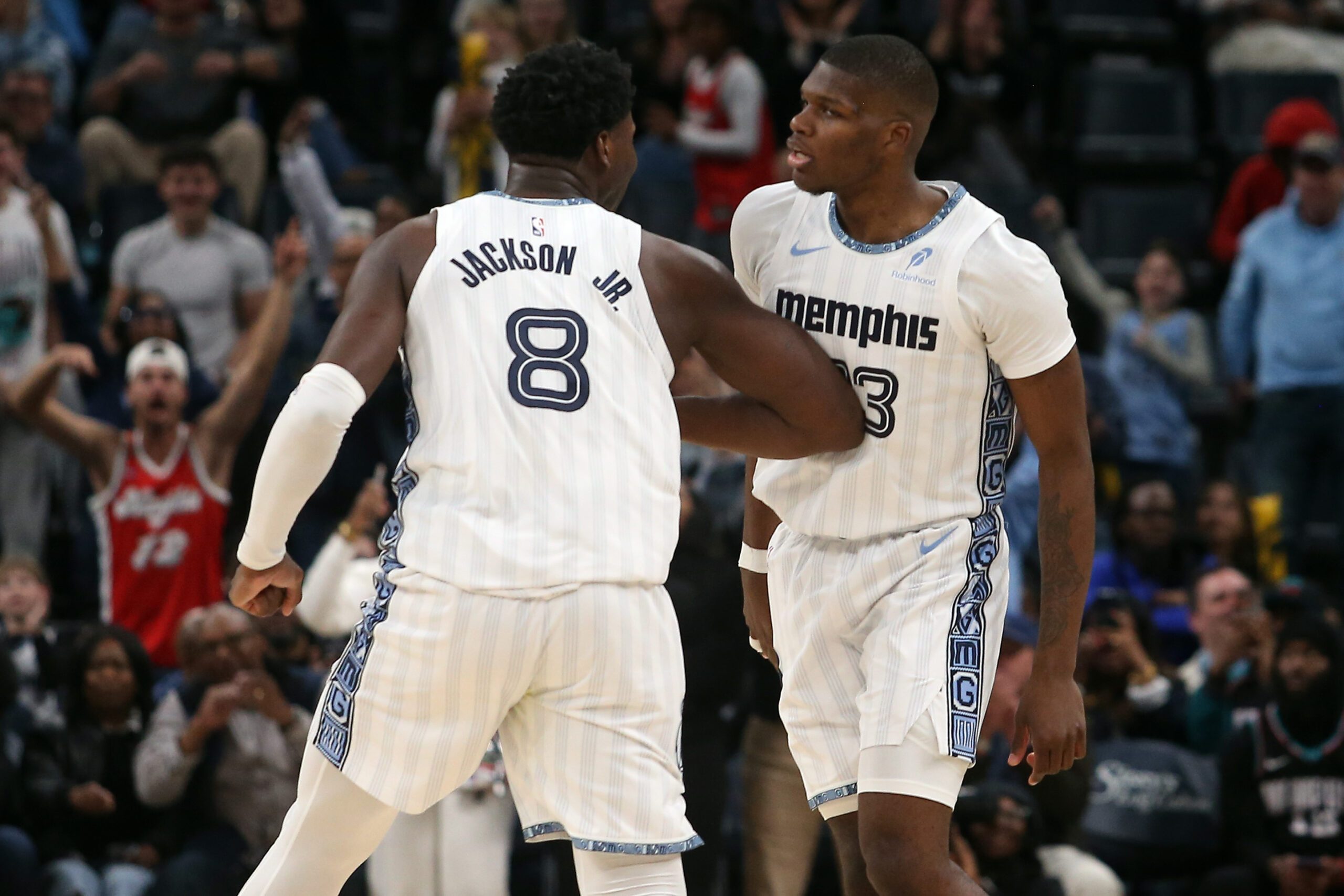 Jan 11, 2026; Memphis, Tennessee, USA; Memphis Grizzlies forward/center Jaren Jackson Jr. (8) reacts with forward Cedric Coward (23) during the fourth quarter against the Brooklyn Nets at FedExForum. Mandatory Credit: Petre Thomas-Imagn Images