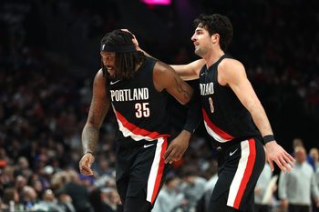 Jan 11, 2026; Portland, Oregon, USA;  Portland Trail Blazers forward Deni Avdija (8) congratulates teammate  center/forward Robert Williams III (35) for scoring against the New York Knicks during the second half at Moda Center. Mandatory Credit: Jaime Valdez-Imagn Images