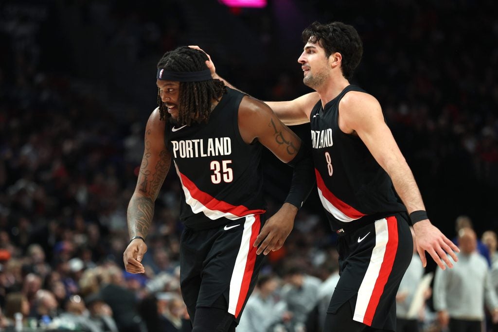 Jan 11, 2026; Portland, Oregon, USA; Portland Trail Blazers forward Deni Avdija (8) congratulates teammate center/forward Robert Williams III (35) for scoring against the New York Knicks during the second half at Moda Center. Mandatory Credit: Jaime Valdez-Imagn Images
