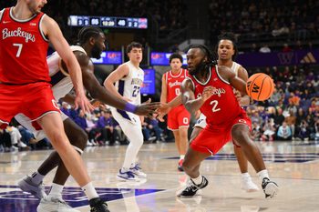 Jan 11, 2026; Seattle, Washington, USA; Ohio State Buckeyes guard Bruce Thornton (2) dribbles the ball while guarded by Washington Huskies center Franck Kepnang (11) during the second half at Alaska Airlines Arena at Hec Edmundson Pavilion. Mandatory Credit: Steven Bisig-Imagn Images
