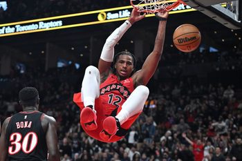 Jan 11, 2026; Toronto, Ontario, CAN;  Toronto Raptors forward Collin Murray-Boyles (12) dunks for a basket against the Philadelphia 76ers in the second half at Scotiabank Arena. Mandatory Credit: Dan Hamilton-Imagn Images