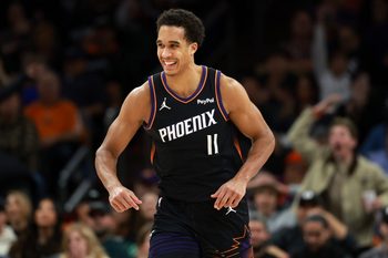 Jan 11, 2026; Phoenix, Arizona, USA; Phoenix Suns forward Oso Ighodaro (11) celebrates a dunk against the Washington Wizards in the second half at Mortgage Matchup Center. Mandatory Credit: Mark J. Rebilas-Imagn Images