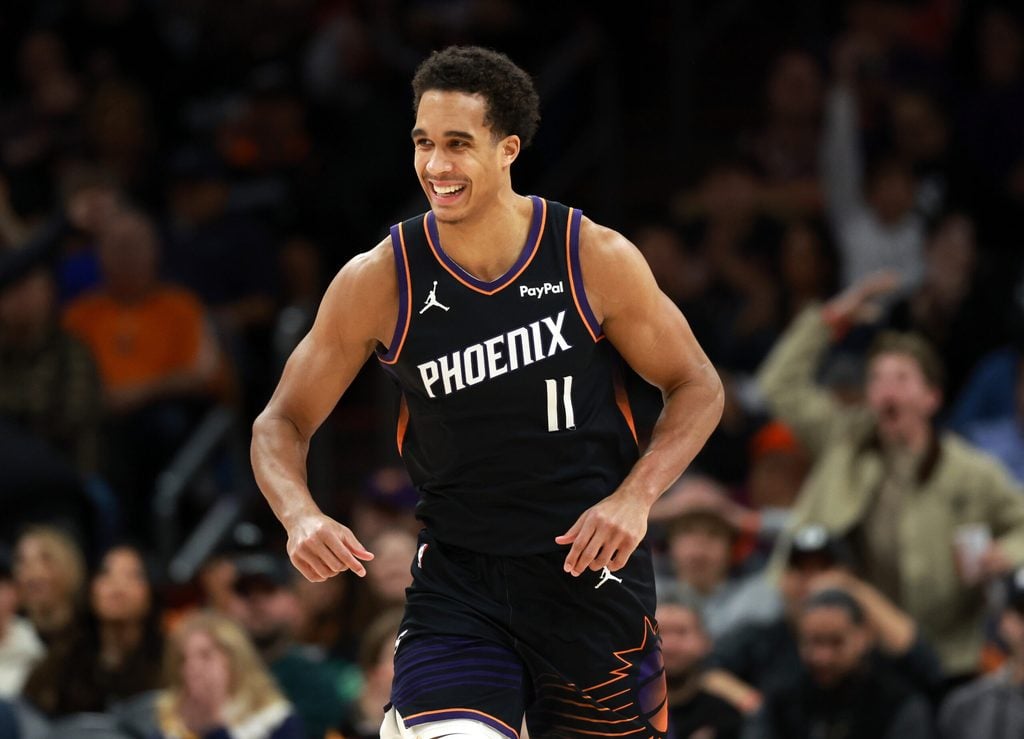 Jan 11, 2026; Phoenix, Arizona, USA; Phoenix Suns forward Oso Ighodaro (11) celebrates a dunk against the Washington Wizards in the second half at Mortgage Matchup Center. Mandatory Credit: Mark J. Rebilas-Imagn Images