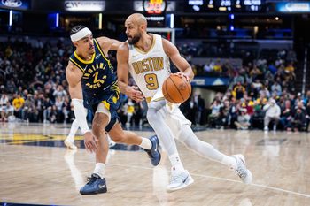 Jan 12, 2026; Indianapolis, Indiana, USA; Boston Celtics guard Derrick White (9) dribbles the ball while Indiana Pacers guard/forward Andrew Nembhard (2) defends in the second half at Gainbridge Fieldhouse. Mandatory Credit: Trevor Ruszkowski-Imagn Images