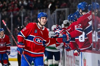Jan 12, 2026; Montreal, Quebec, CAN; Montreal Canadiens left wing Juraj Slafkovsky (20) celebrates with his teammates at the bench his goal against the Vancouver Canucks during the third period at Bell Centre. Mandatory Credit: David Kirouac-Imagn Images