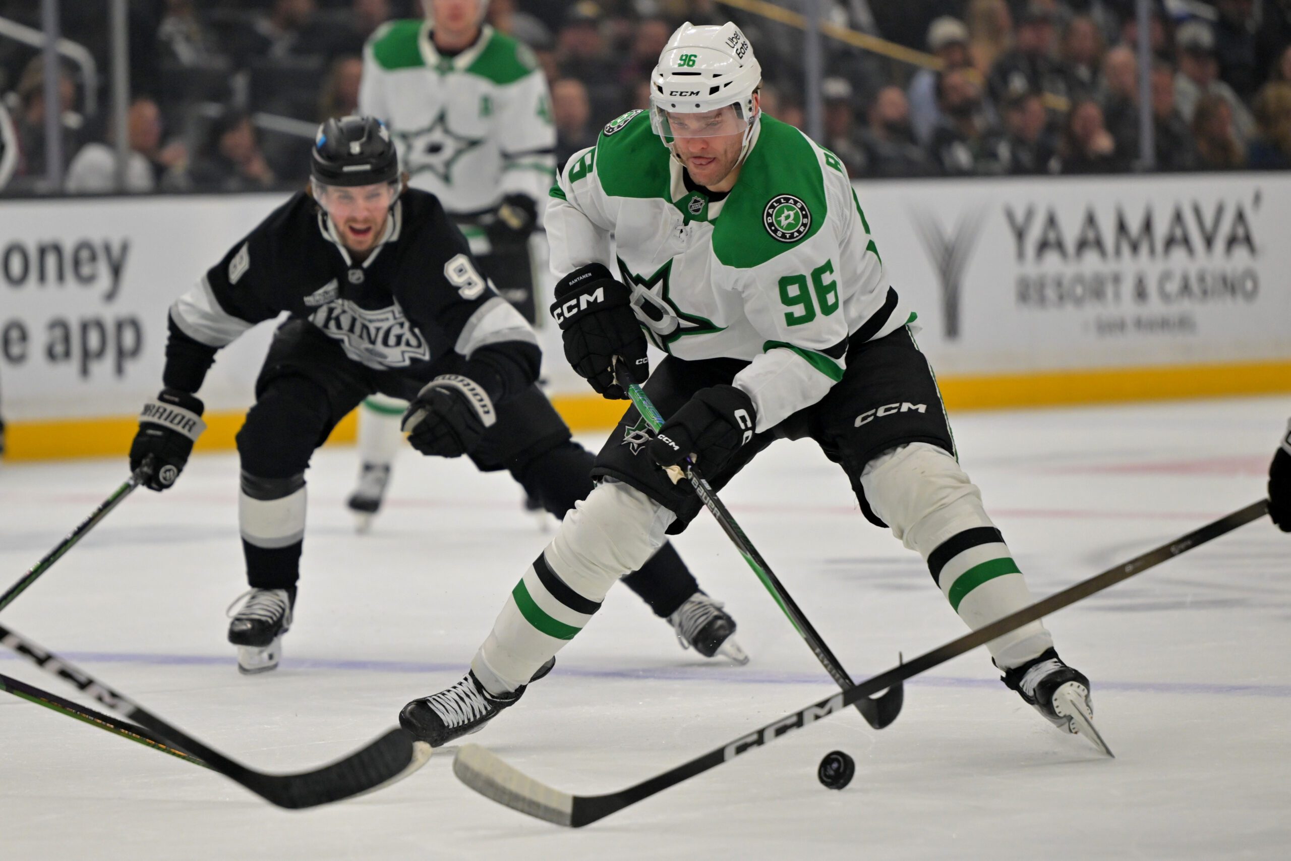 Jan 12, 2026; Los Angeles, California, USA;  Dallas Stars right wing Mikko Rantanen (96) is chased down by Los Angeles Kings right wing Adrian Kempe (9) as he skates down ice in the first period at Crypto.com Arena. Mandatory Credit: Jayne Kamin-Oncea-Imagn Images