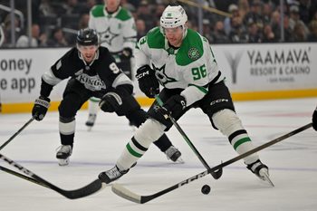 Jan 12, 2026; Los Angeles, California, USA;  Dallas Stars right wing Mikko Rantanen (96) is chased down by Los Angeles Kings right wing Adrian Kempe (9) as he skates down ice in the first period at Crypto.com Arena. Mandatory Credit: Jayne Kamin-Oncea-Imagn Images