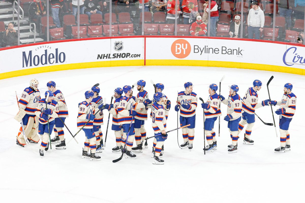 Jan 12, 2026; Chicago, Illinois, USA; Edmonton Oilers players celebrate after defeating the Chicago Blackhawks at United Center. Mandatory Credit: Kamil Krzaczynski-Imagn Images