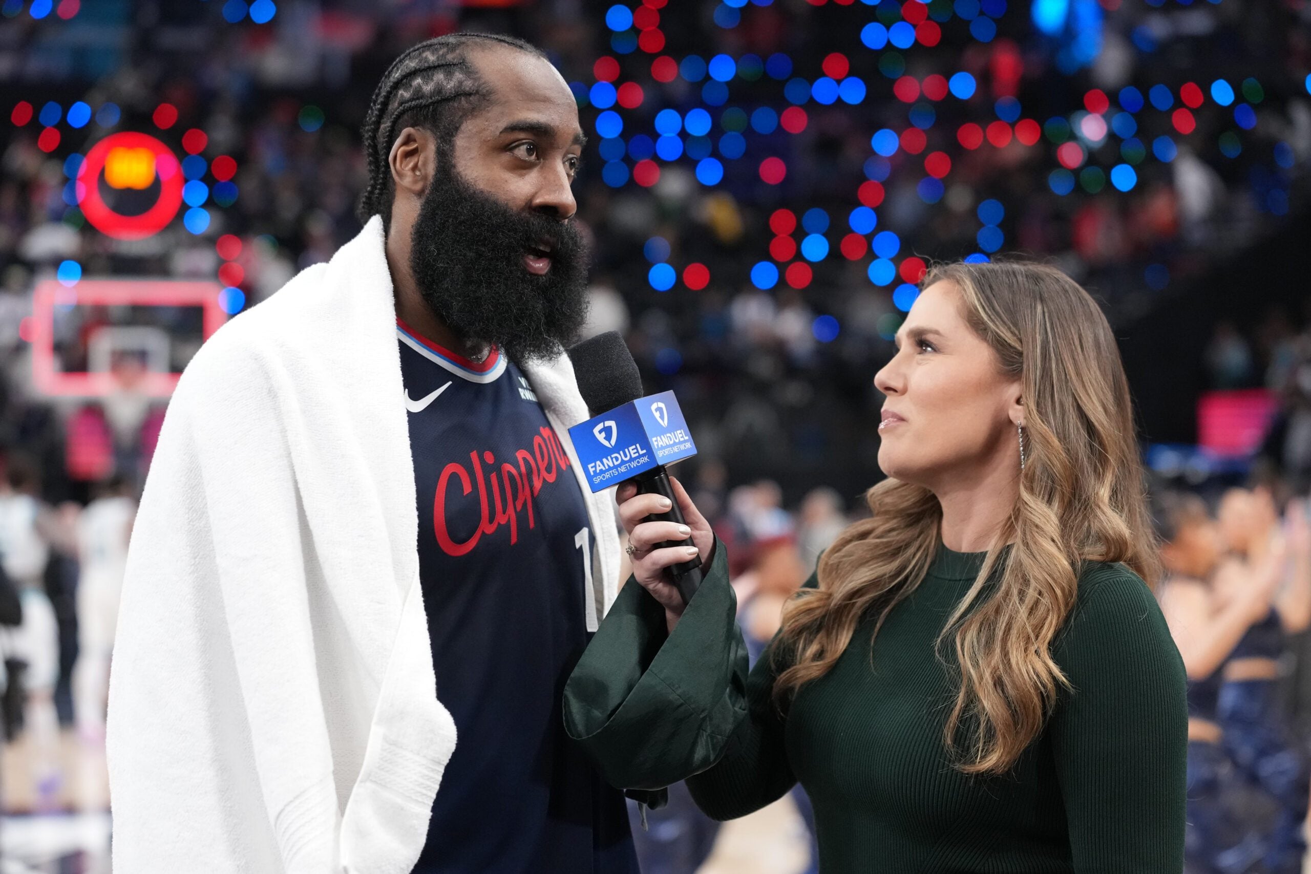 Jan 12, 2026; Inglewood, California, USA; FanDuel Sports Network reporter Jaime Maggio interviews LA Clippers guard James Harden (1) after the game against the Charlotte Hornets at the Intuit Dome. Mandatory Credit: Kirby Lee-Imagn Images