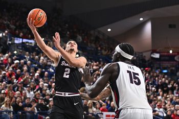 Jan 8, 2026; Spokane, Washington, USA; Santa Clara Broncos guard Sash Gavalyugov (2) shoots the ball against Gonzaga Bulldogs forward Graham Ike (15) in the second half at McCarthey Athletic Center. Mandatory Credit: James Snook-Imagn Images