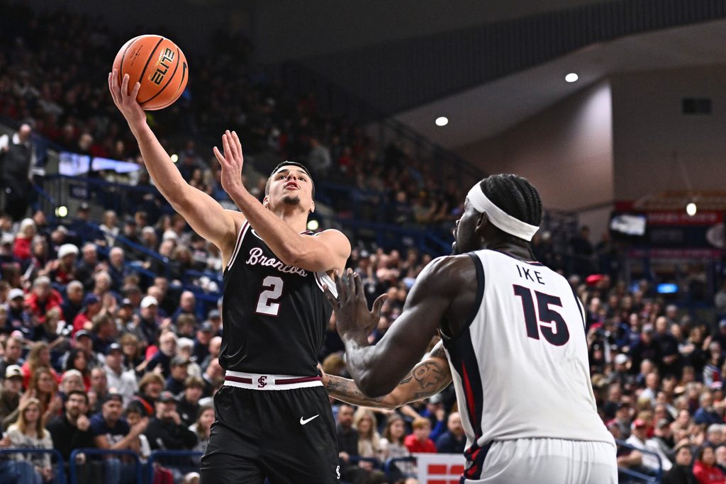 Jan 8, 2026; Spokane, Washington, USA; Santa Clara Broncos guard Sash Gavalyugov (2) shoots the ball against Gonzaga Bulldogs forward Graham Ike (15) in the second half at McCarthey Athletic Center. Mandatory Credit: James Snook-Imagn Images
