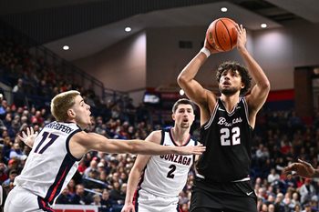 Jan 8, 2026; Spokane, Washington, USA; Santa Clara Broncos forward Allen Graves (22) shoots the ball against Gonzaga Bulldogs guard Mario Saint-Supery (17) in the second half at McCarthey Athletic Center. Mandatory Credit: James Snook-Imagn Images