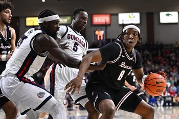 Jan 8, 2026; Spokane, Washington, USA; Santa Clara Broncos forward Elijah Mahi (8) controls the ball against Gonzaga Bulldogs forward Emmanuel Innocenti (5) in the second half at McCarthey Athletic Center. Mandatory Credit: James Snook-Imagn Images