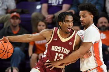 Boston College Eagles guard Donald Hand Jr. (13) is defended by Clemson Tigers guard Efrem Johnson (4) Tuesday, Jan. 13, 2026, during the NCAA men’s basketball game at Littlejohn Coliseum in Clemson, South Carolina.
