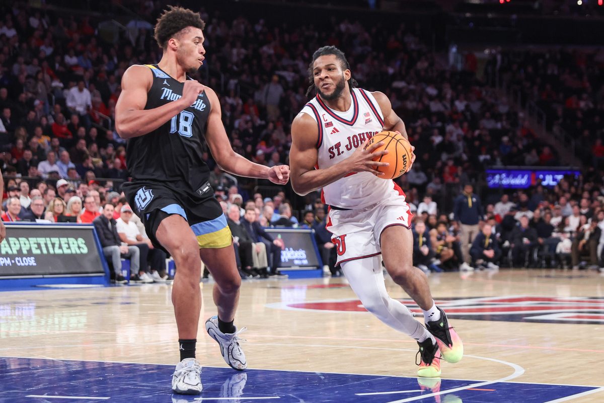 Jan 13, 2026; New York, New York, USA; St. John's Red Storm forward Zuby Ejiofor (24) drives past Marquette Golden Eagles forward Caedin Hamilton (18) in the second half at Madison Square Garden Mandatory Credit: Wendell Cruz-Imagn Images