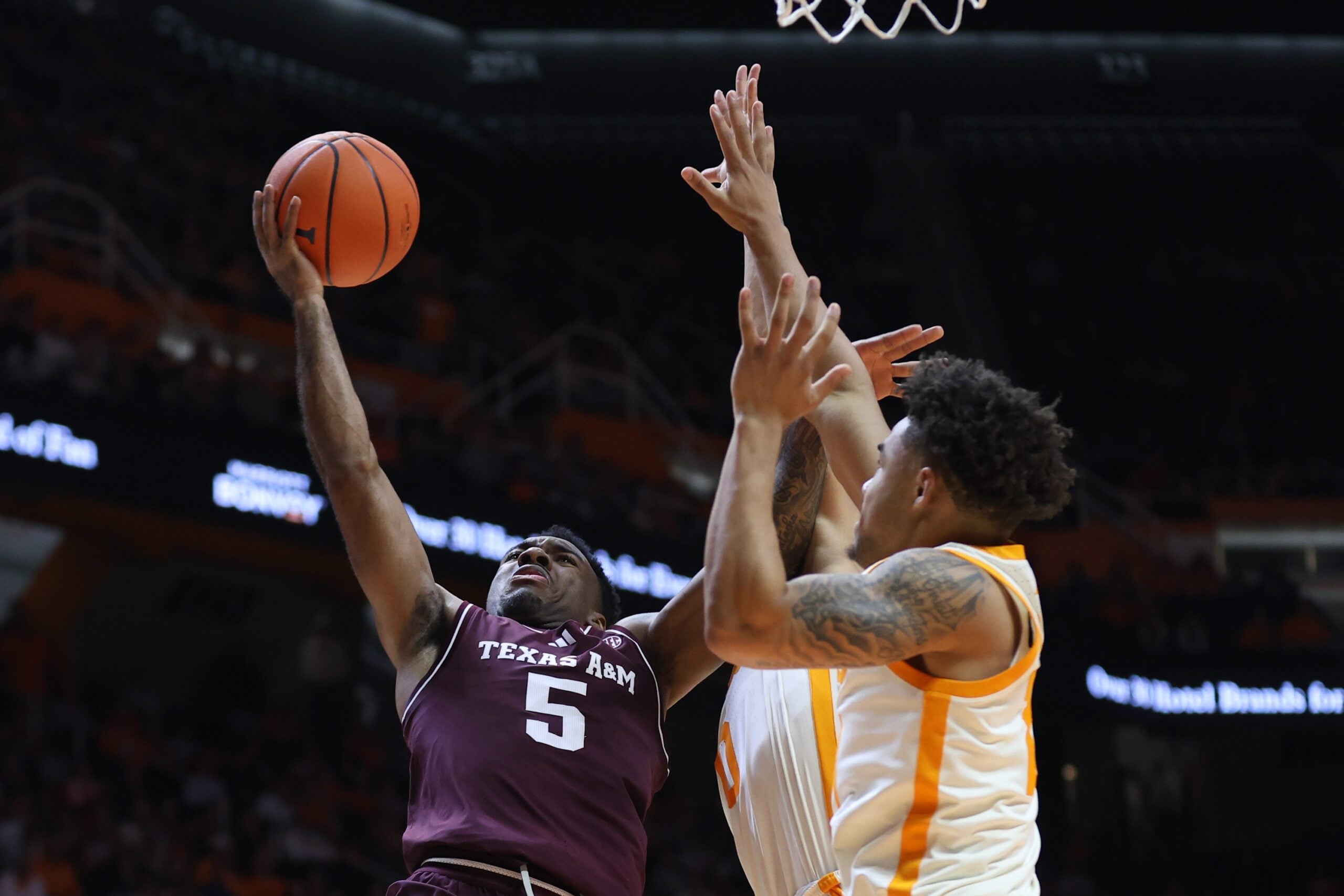 Jan 13, 2026; Knoxville, Tennessee, USA;  Texas A&M Aggies guard Jacari Lane (5) drives to the basket against the Tennessee Volunteers during the second half at Thompson-Boling Arena at Food City Center. Mandatory Credit: Randy Sartin-Imagn Images
