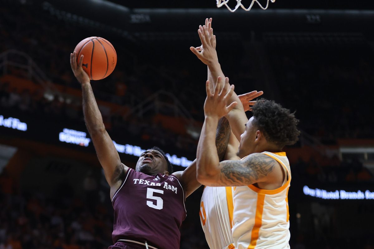 Jan 13, 2026; Knoxville, Tennessee, USA; Texas A&M Aggies guard Jacari Lane (5) drives to the basket against the Tennessee Volunteers during the second half at Thompson-Boling Arena at Food City Center. Mandatory Credit: Randy Sartin-Imagn Images