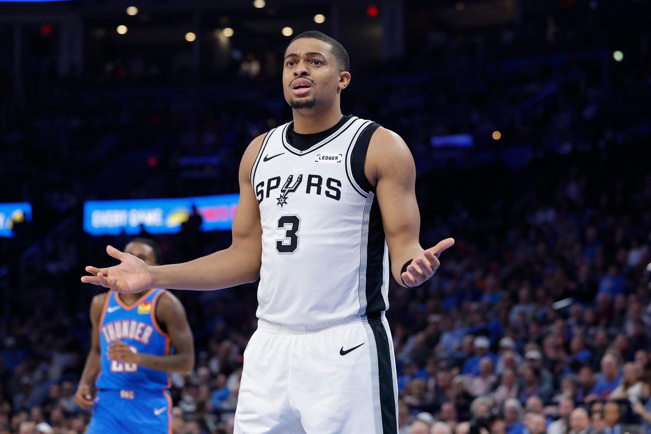 Jan 13, 2026; Oklahoma City, Oklahoma, USA; San Antonio Spurs forward/guard Keldon Johnson (3) reacts after a play against the Oklahoma City Thunder during the second half at Paycom Center. Mandatory Credit: Alonzo Adams-Imagn Images