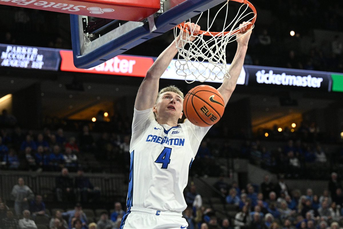 Jan 13, 2026; Omaha, Nebraska, USA; Creighton Bluejays guard Josh Dix (4) dunks against the Georgetown Hoyas during the second half at CHI Health Center Omaha. Mandatory Credit: Steven Branscombe-Imagn Images