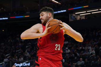 Jan 13, 2026; San Francisco, California, USA;  Portland Trail Blazers center Donovan Clingan (23) grabs a rebound against the Golden State Warriors in the third quarter at Chase Center. Mandatory Credit: David Gonzales-Imagn Images