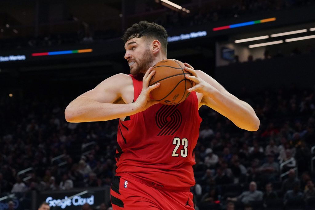 Jan 13, 2026; San Francisco, California, USA; Portland Trail Blazers center Donovan Clingan (23) grabs a rebound against the Golden State Warriors in the third quarter at Chase Center. Mandatory Credit: David Gonzales-Imagn Images