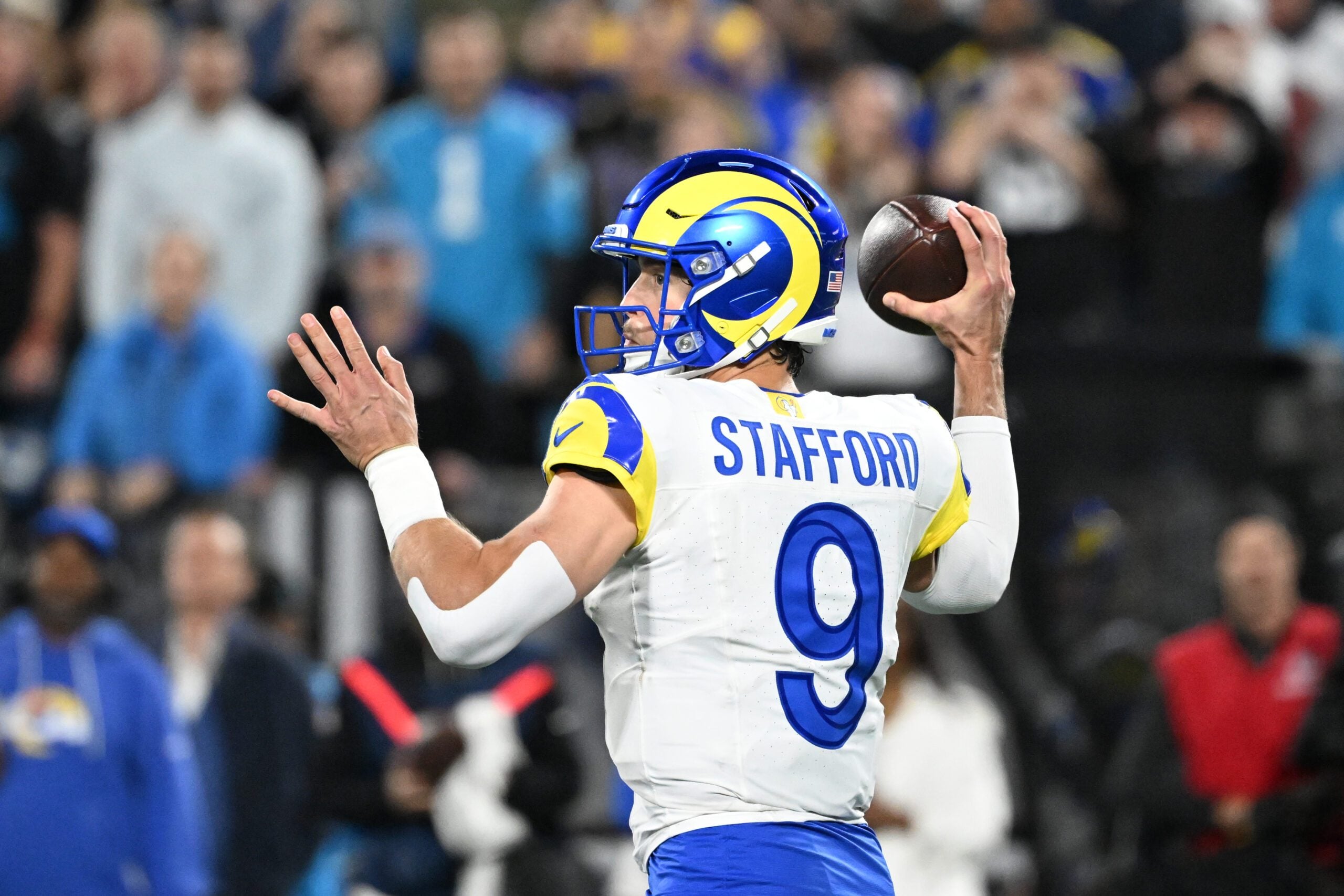 Jan 10, 2026; Charlotte, NC, USA; Los Angeles Rams quarterback Matthew Stafford (9) passes the ball in the fourth quarter in an NFC Wild Card Round game at Bank of America Stadium. Mandatory Credit: Bob Donnan-Imagn Images