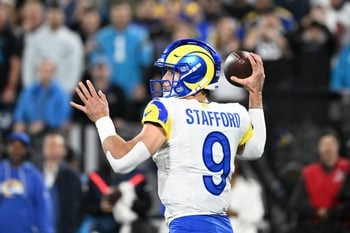 Jan 10, 2026; Charlotte, NC, USA; Los Angeles Rams quarterback Matthew Stafford (9) passes the ball in the fourth quarter in an NFC Wild Card Round game at Bank of America Stadium. Mandatory Credit: Bob Donnan-Imagn Images