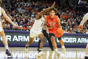 Jan 14, 2026; Evanston, Illinois, USA; Northwestern Wildcats guard Jordan Clayton (11) defends Illinois Fighting Illini guard Keaton Wagler (23) during the first half at Welsh-Ryan Arena. Mandatory Credit: David Banks-Imagn Images