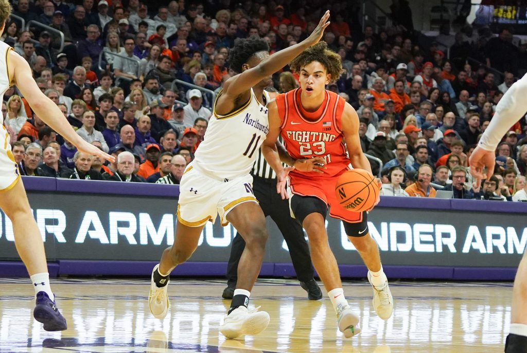 Jan 14, 2026; Evanston, Illinois, USA; Northwestern Wildcats guard Jordan Clayton (11) defends Illinois Fighting Illini guard Keaton Wagler (23) during the first half at Welsh-Ryan Arena. Mandatory Credit: David Banks-Imagn Images