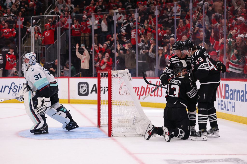 Jan 14, 2026; Newark, New Jersey, USA; New Jersey Devils center Nico Hischier (13) celebrates his game winning goal with his teammates against the Seattle Kraken during overtime at Prudential Center. Mandatory Credit: Ed Mulholland-Imagn Images