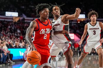 Jan 14, 2026; Athens, Georgia, USA; Mississippi Rebels guard AJ Storr (2) dribbles defended by Georgia Bulldogs guard Jeremiah Wilkinson (5) during the first half at Stegeman Coliseum. Mandatory Credit: Dale Zanine-Imagn Images