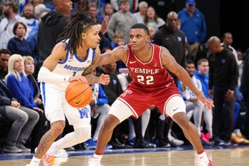 Jan 14, 2026; Memphis, Tennessee, USA; Temple Owls guard Derrian Ford (22) guards Memphis Tigers guard Dug McDaniel (1) during the second half at FedExForum. Mandatory Credit: Wesley Hale-Imagn Images