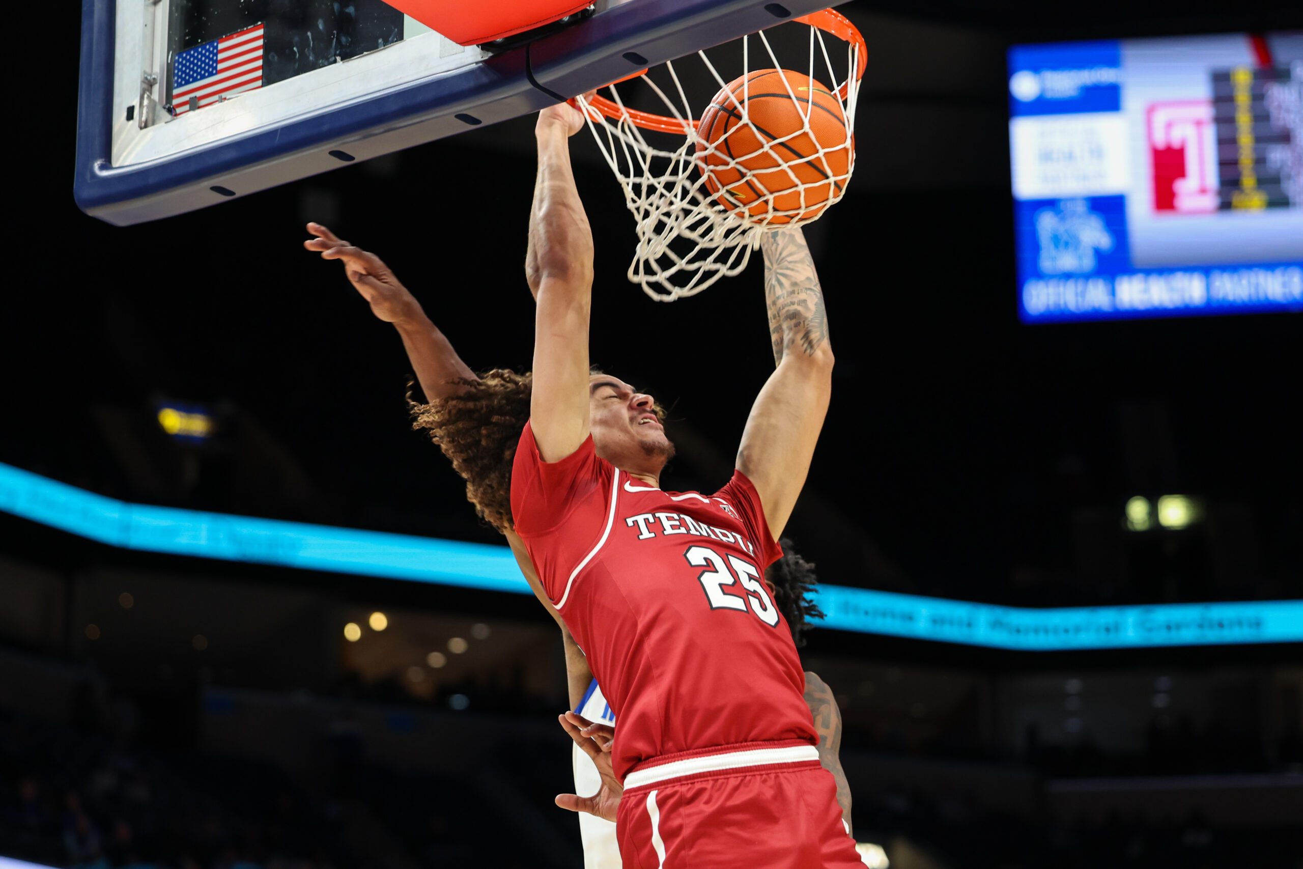 Jan 14, 2026; Memphis, Tennessee, USA; Temple Owls guard Aiden Tobiason (25) dunks the ball against the Memphis Tigers during the second half at FedExForum. Mandatory Credit: Wesley Hale-Imagn Images