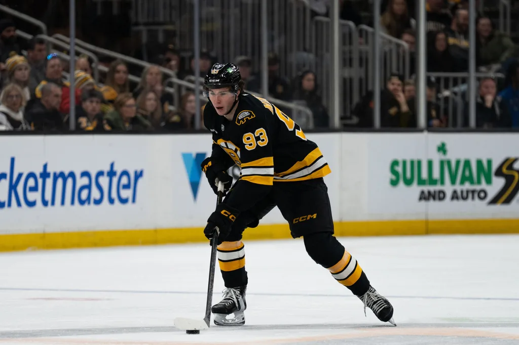 Jan 11, 2026; Boston, Massachusetts, USA; Boston Bruins center Fraser Minten (93) skates with the puck during the third period of the game against the Pittsburgh Penguins at TD Garden. Mandatory Credit: Natalie Reid-Imagn Images