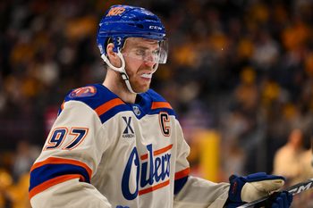Jan 13, 2026; Nashville, Tennessee, USA;  Edmonton Oilers center Connor McDavid (97) awaits the face off against the Nashville Predators during the second period at Bridgestone Arena. Mandatory Credit: Steve Roberts-Imagn Images