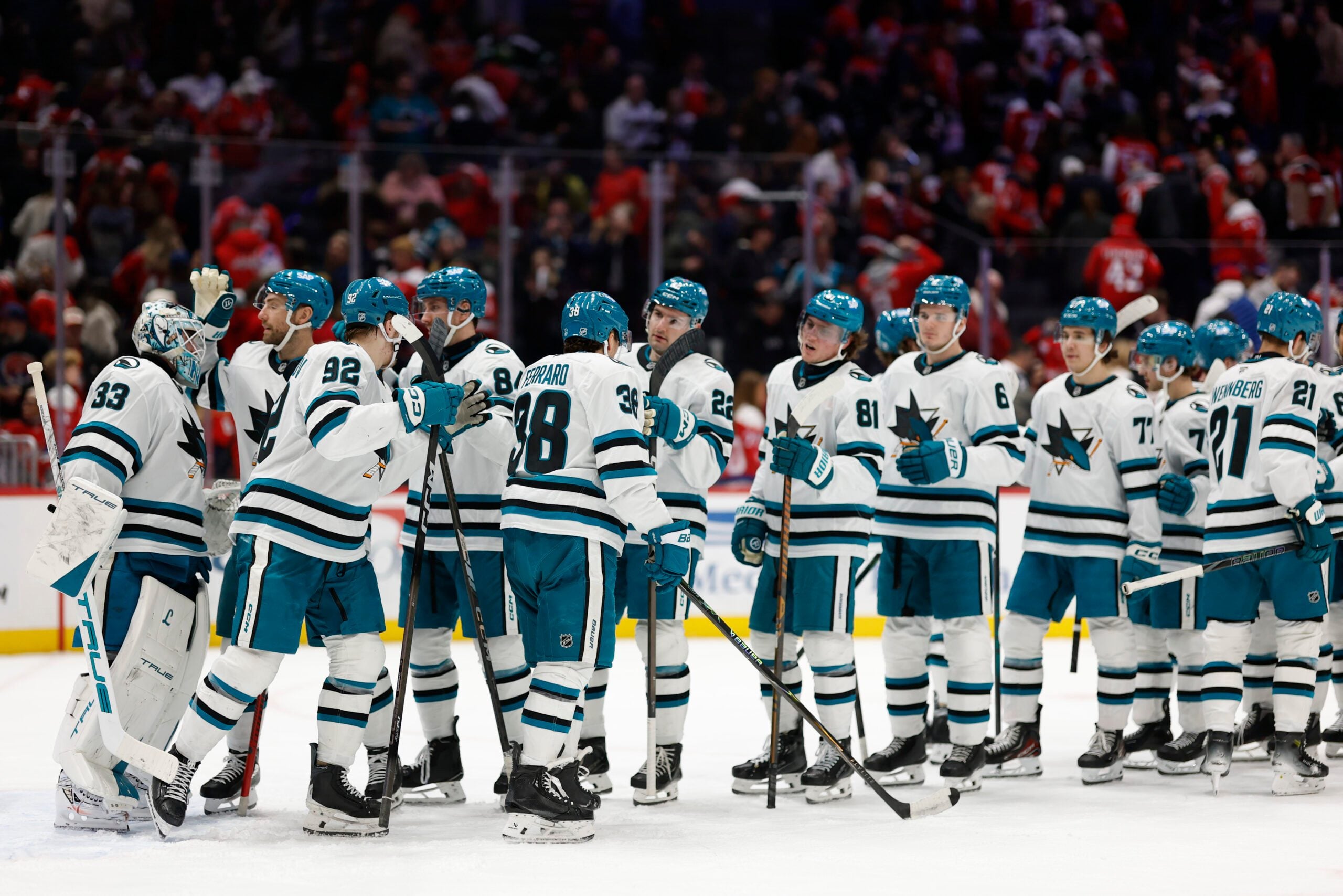 Jan 15, 2026; Washington, District of Columbia, USA; San Jose Sharks goaltender Alex Nedeljkovic (33) celebrates with teammates after their game against the Washington Capitals at Capital One Arena. Mandatory Credit: Geoff Burke-Imagn Images