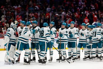Jan 15, 2026; Washington, District of Columbia, USA; San Jose Sharks goaltender Alex Nedeljkovic (33) celebrates with teammates after their game against the Washington Capitals at Capital One Arena. Mandatory Credit: Geoff Burke-Imagn Images