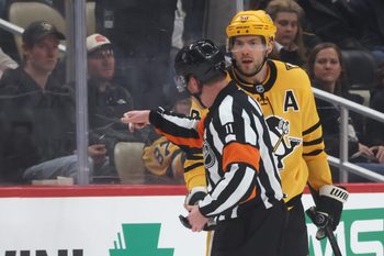 Jan 15, 2026; Pittsburgh, Pennsylvania, USA;  Pittsburgh Penguins defenseman Kris Letang (58) reacts a to referee Kelly Sutherland (11) after being penalized for boarding against the Philadelphia Flyers during the third period at PPG Paints Arena. Mandatory Credit: Charles LeClaire-Imagn Images