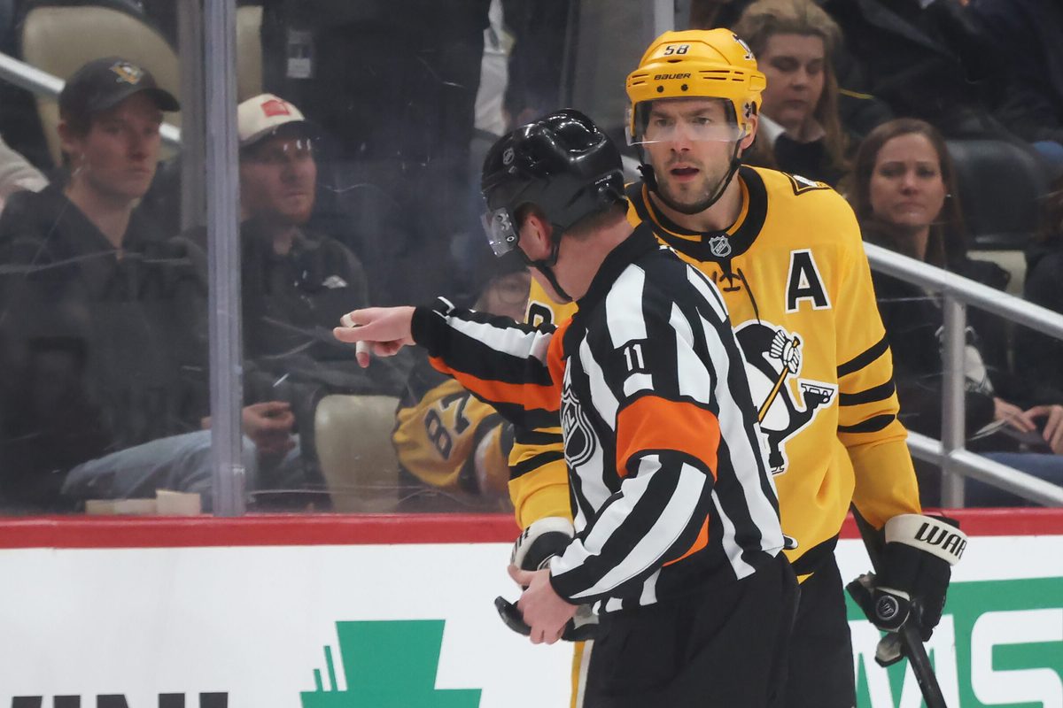 Jan 15, 2026; Pittsburgh, Pennsylvania, USA; Pittsburgh Penguins defenseman Kris Letang (58) reacts a to referee Kelly Sutherland (11) after being penalized for boarding against the Philadelphia Flyers during the third period at PPG Paints Arena. Mandatory Credit: Charles LeClaire-Imagn Images