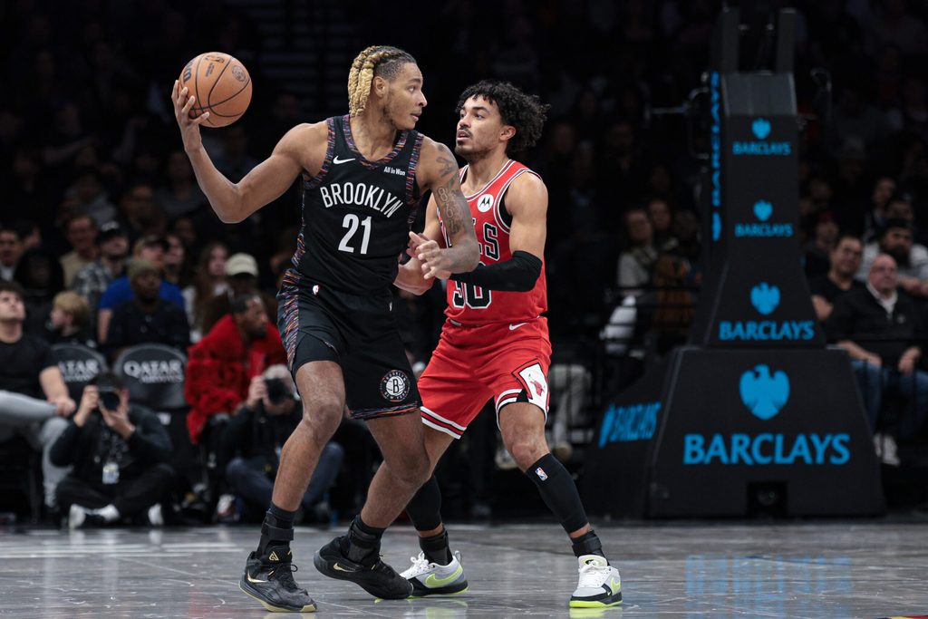 Jan 16, 2026; Brooklyn, New York, USA; Brooklyn Nets forward Noah Clowney (21) shields the ball from Chicago Bulls guard Tre Jones (30) during the second half at Barclays Center. Mandatory Credit: Vincent Carchietta-Imagn Images
