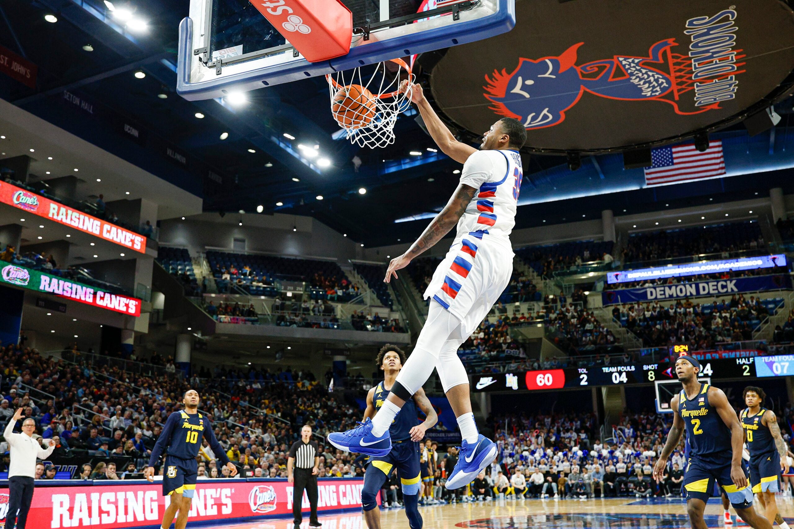 Jan 16, 2026; Chicago, Illinois, USA; DePaul Blue Demons forward N.J. Benson (35) scores against Marquette Golden Eagles during the second half at Wintrust Arena. Mandatory Credit: Kamil Krzaczynski-Imagn Images