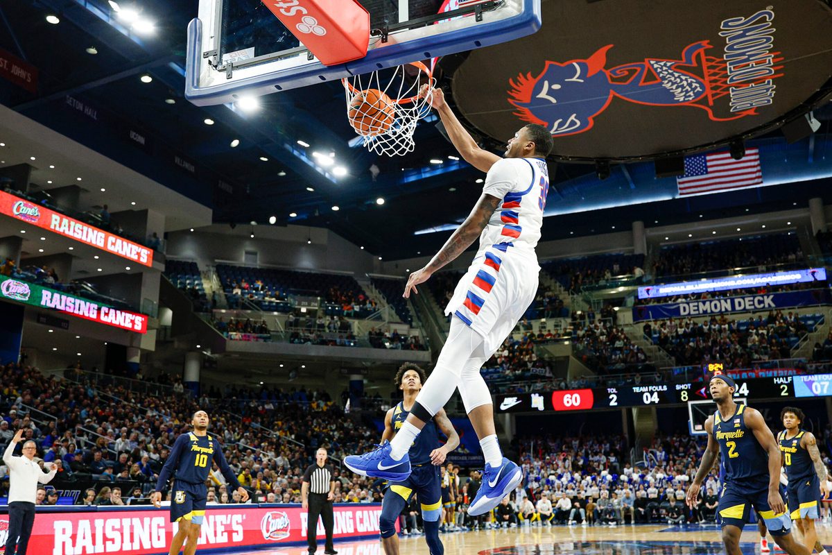 Jan 16, 2026; Chicago, Illinois, USA; DePaul Blue Demons forward N.J. Benson (35) scores against Marquette Golden Eagles during the second half at Wintrust Arena. Mandatory Credit: Kamil Krzaczynski-Imagn Images