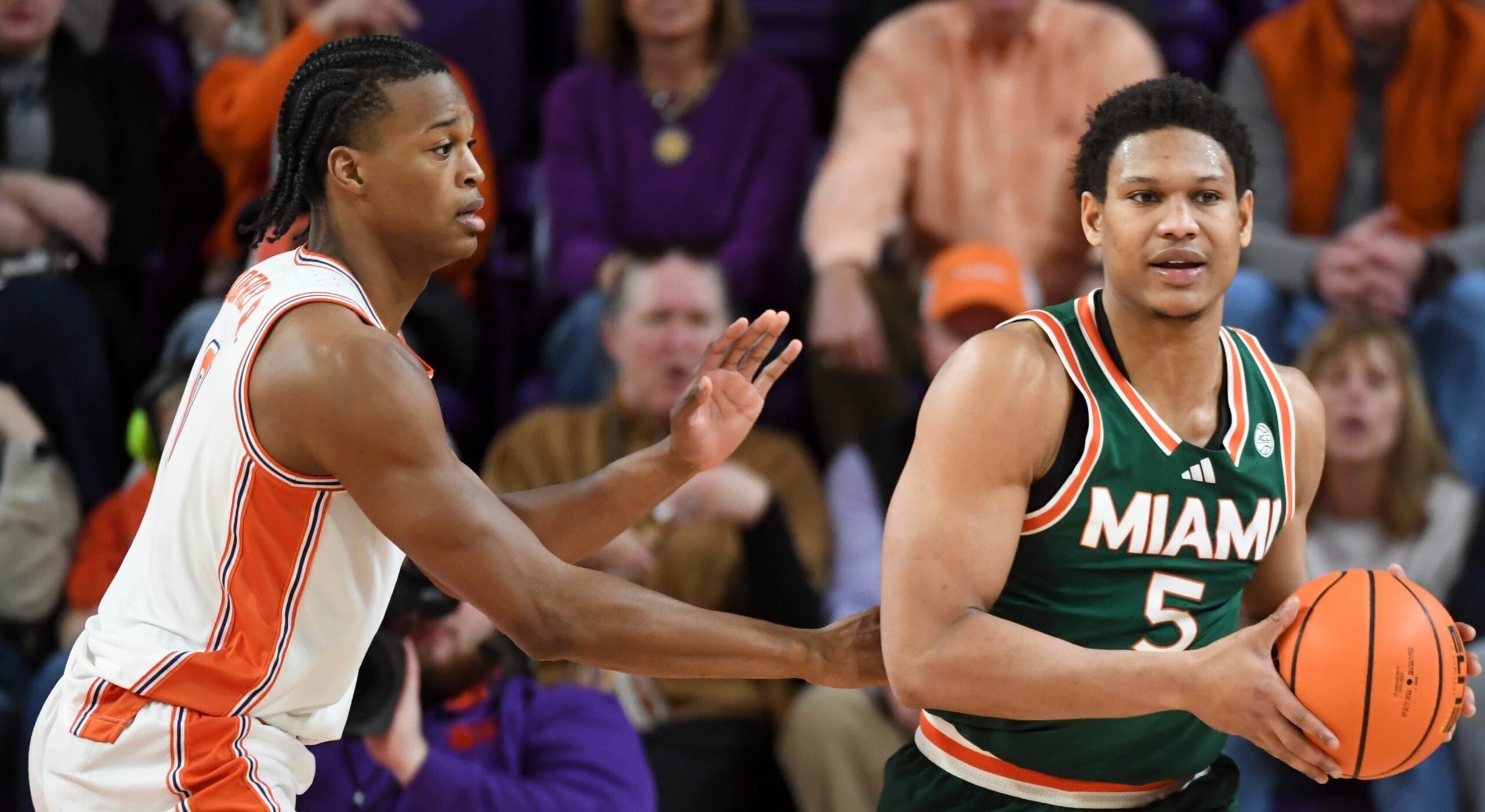 Clemson Tigers forward RJ Godfrey (0) defends Miami Hurricanes forward Malik Reneau (5) Saturday, Jan. 17, 2026, during the NCAA men’s basketball game at Littlejohn Coliseum in Clemson, South Carolina.