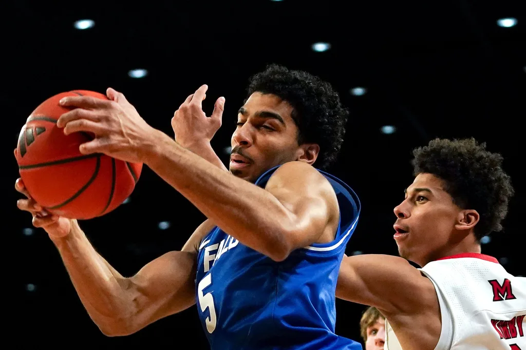 Buffalo Bulls guard Daniel Freitag (5) rebounds the ball in the first half of a NCAA men’s basketball game between the Miami RedHawks and Buffalo Bulls, Saturday, Jan. 17, 2026, at Millett Hall in Oxford, Oh.