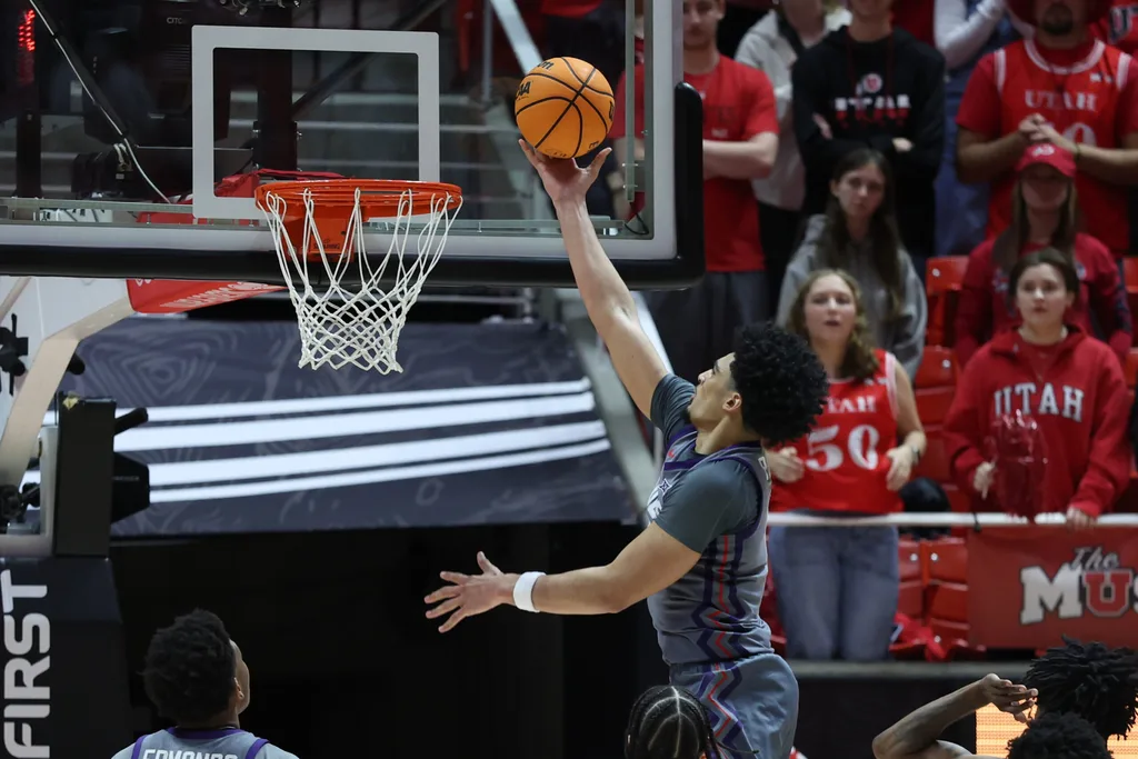 Jan 17, 2026; Salt Lake City, Utah, USA; TCU Horned Frogs forward David Punch (15) goes for a layup against the Utah Utes during the second half at Jon M. Huntsman Center. Mandatory Credit: Rob Gray-Imagn Images