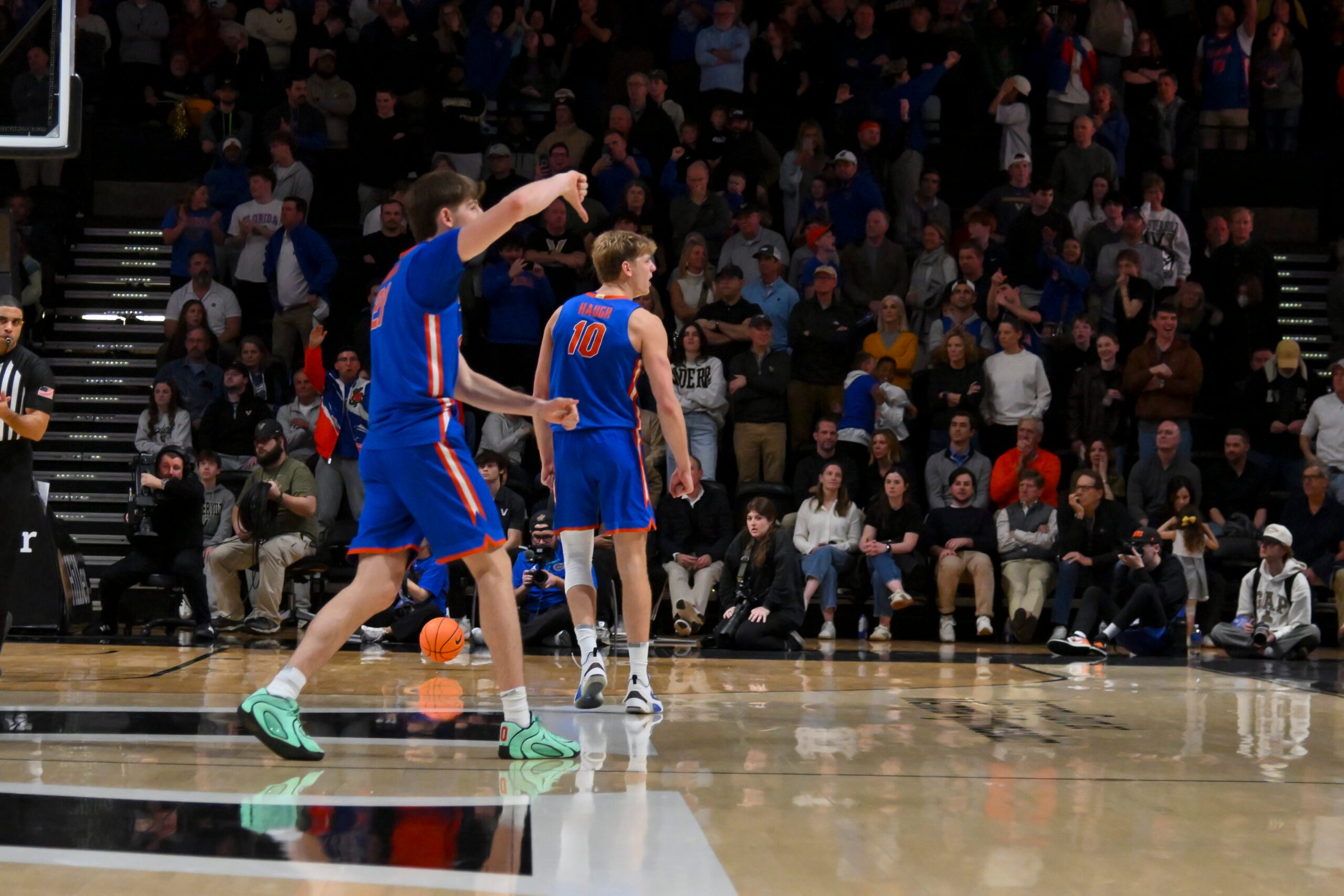 Jan 17, 2026; Nashville, Tennessee, USA;  Florida Gators forward Alex Condon (21) and forward Thomas Haugh (10) taunt the Vanderbilt Commodores student section during the second half at Memorial Gymnasium. Mandatory Credit: Steve Roberts-Imagn Images