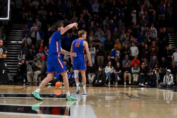 Jan 17, 2026; Nashville, Tennessee, USA;  Florida Gators forward Alex Condon (21) and forward Thomas Haugh (10) taunt the Vanderbilt Commodores student section during the second half at Memorial Gymnasium. Mandatory Credit: Steve Roberts-Imagn Images