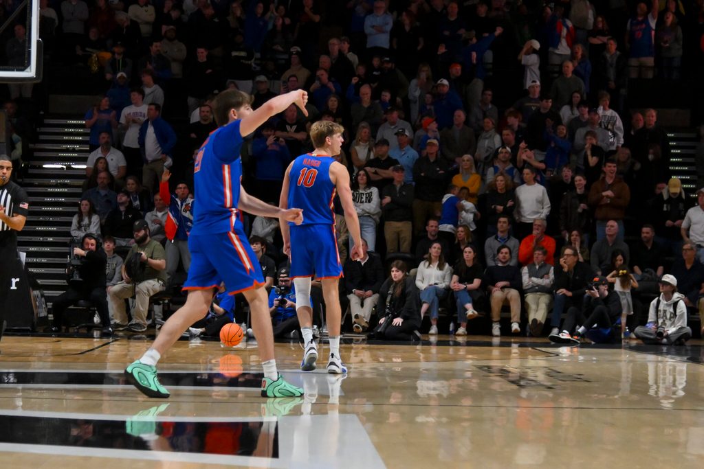 Jan 17, 2026; Nashville, Tennessee, USA; Florida Gators forward Alex Condon (21) and forward Thomas Haugh (10) taunt the Vanderbilt Commodores student section during the second half at Memorial Gymnasium. Mandatory Credit: Steve Roberts-Imagn Images