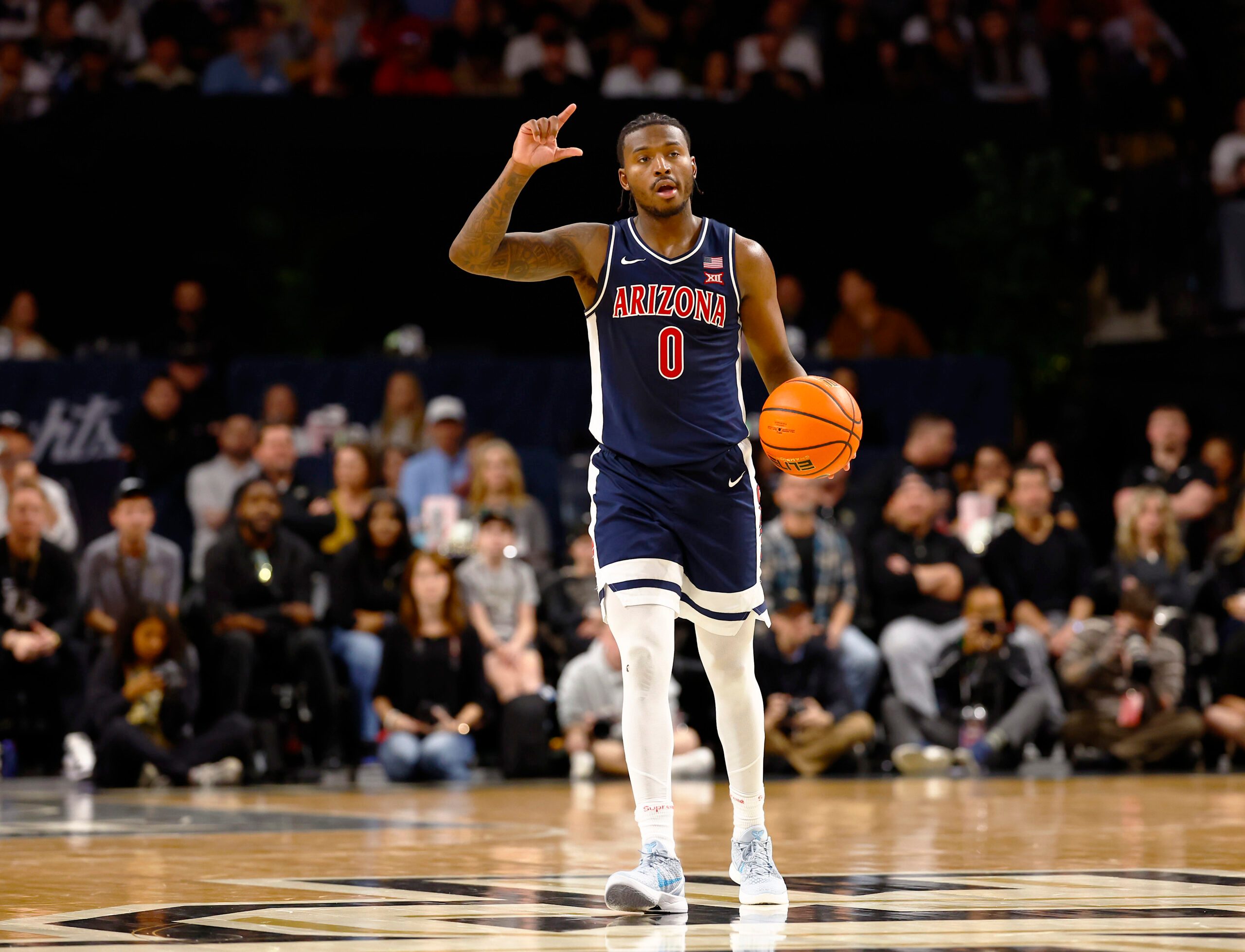 Jan 17, 2026; Orlando, Florida, USA;  Arizona Wildcats guard Jaden Bradley (0) calls a play during the second half against the Central Florida Knights at Addition Financial Arena. Mandatory Credit: Russell Lansford-Imagn Images