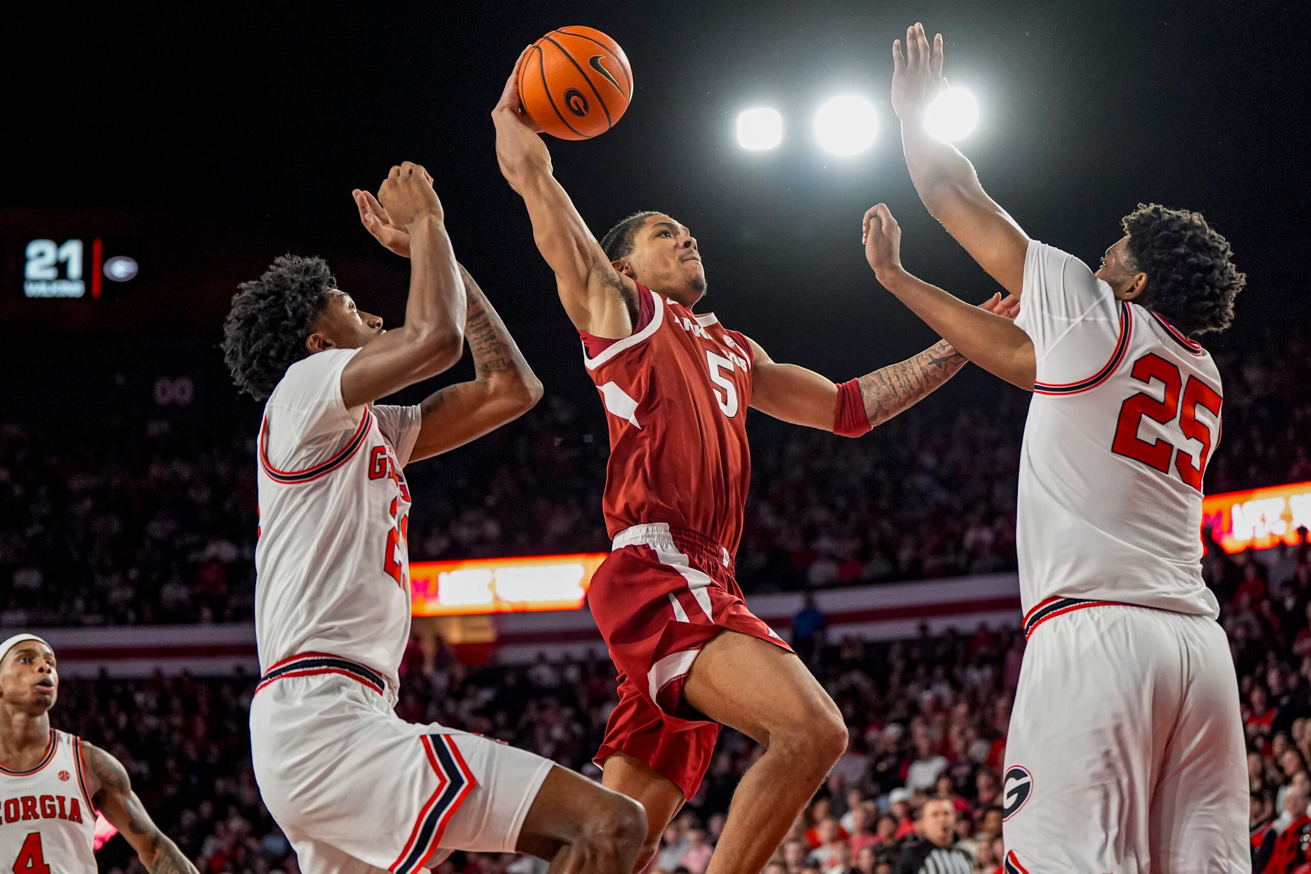 Jan 17, 2026; Athens, Georgia, USA; Arkansas Razorbacks guard Darius Acuff Jr. (5) tries to get to the basket against Georgia Bulldogs forward Justin Abson (25) during the second half at Stegeman Coliseum. Mandatory Credit: Dale Zanine-Imagn Images